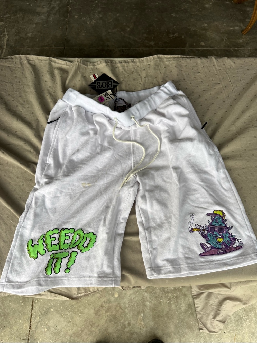 White Graphic Athletic Drawstring Shorts with Green 'Weed It' Accent